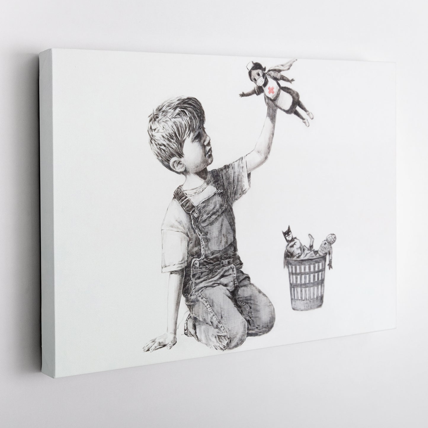 Banksy 'Boy with Superhero Doll' Canvas Print - Framed Wall Art