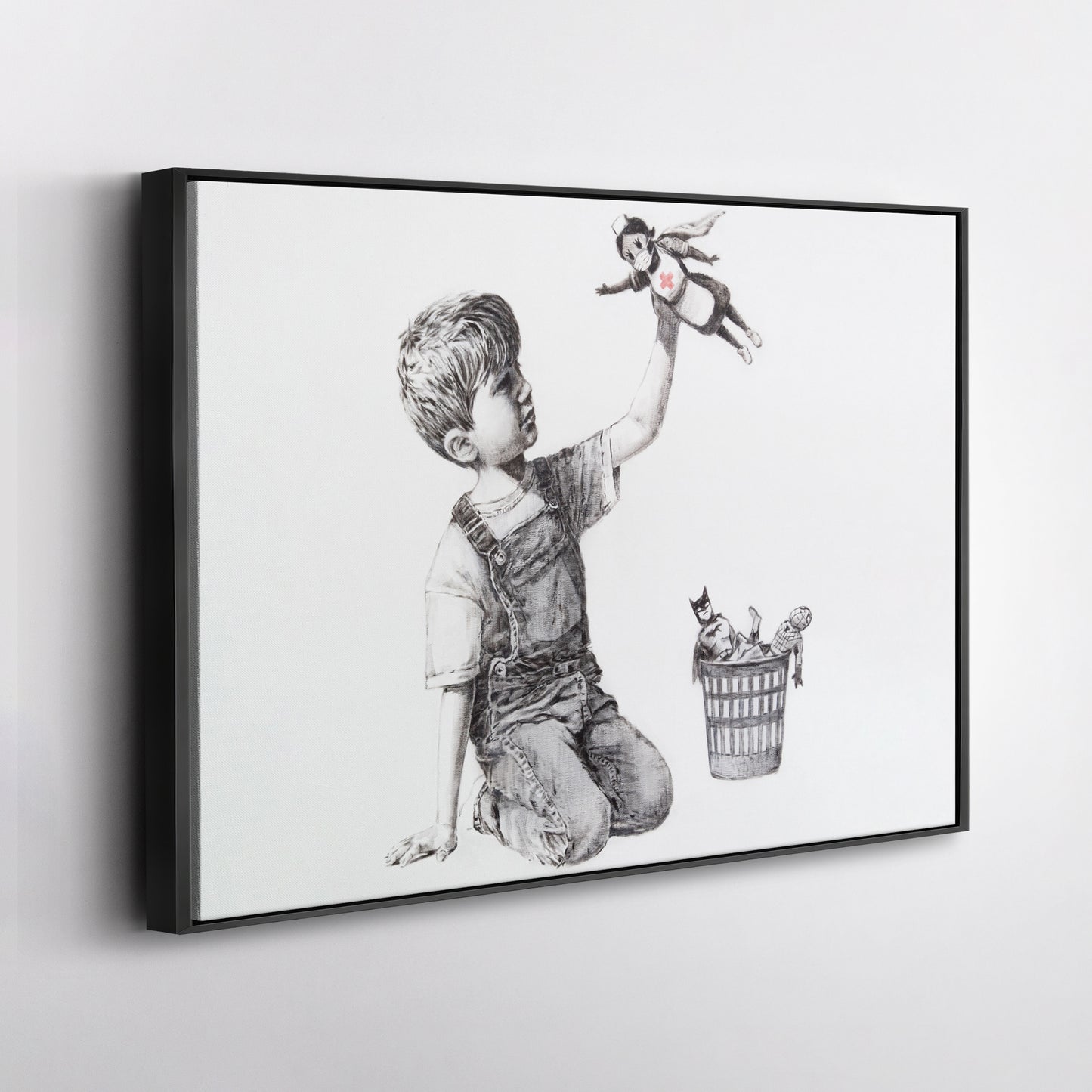 Banksy 'Boy with Superhero Doll' Canvas Print - Framed Wall Art